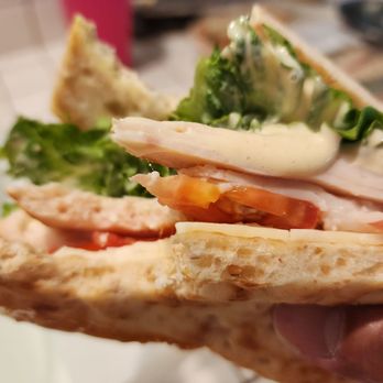 Costco Wholesale - Chicken sandwich with sauce comes with meat, lettuce, and tomato between flatbread. - Gas Stations Near Me - La Habra, California Costco Wholesale - Chicken sandwich with sauce comes with meat, lettuce, and tomato between flatbread. - Gas Stations Near Me - La Habra, California