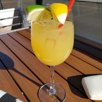 Third Glass Bar - Apparently this is a white sangria. It looks and tasty like a glass of orange juice. - Wine Bars Near Me - Moncton, New Brunswick