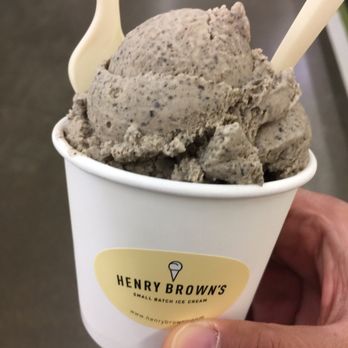Henry Brown's Small Batch Ice Cream Company - a hand holding a cup of ice cream - Desserts Near Me - Hamilton, Ontario Henry Brown's Small Batch Ice Cream Company - a hand holding a cup of ice cream - Desserts Near Me - Hamilton, Ontario