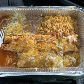 Sabor a Mexico - Large plate combo- enchilada and burrito. $16.50. Take out, fork for size reference. - Mexican Near Me - Mukilteo, Washington