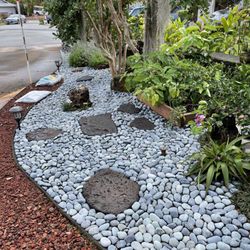 Geobunga - Pavers and tons of river rocks cover where there was once just dirt.
