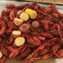 Craws and Claws - Crawfish with boiled potatoes, corn, and a boudin link.