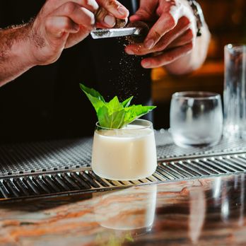 Mercy Me - a bartender sprinkling a minty drink - New American Near Me - Washington, DC, District of Columbia Mercy Me - a bartender sprinkling a minty drink - New American Near Me - Washington, DC, District of Columbia