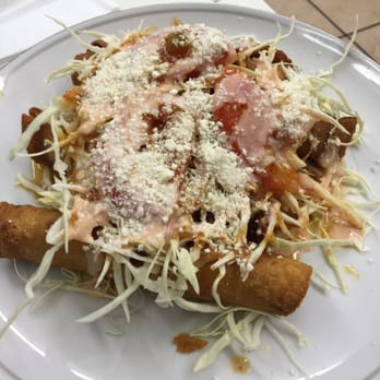 La Colonia - a plate of food on a table - Latin American Near Me - Jacksonville, Florida La Colonia - a plate of food on a table - Latin American Near Me - Jacksonville, Florida
