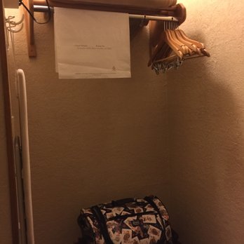 Aarchway Inn - Cute little open closet area with hangers an iron and ironing board at the Archway Hotel in Moab Utah - Hotels Near Me - Moab, Utah
