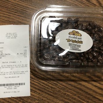 The Nuts Castle - a receipt and a plastic container of chocolate beans - Specialty Food Near Me - Chicago, Illinois