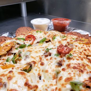 Ringers Original Pizza - a closeup of a pizza - Pizza Near Me - Saskatoon, Saskatchewan Ringers Original Pizza - a closeup of a pizza - Pizza Near Me - Saskatoon, Saskatchewan