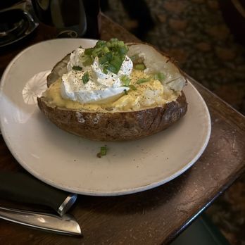 Metropolitan Grill - Baked potato with a cheese sauce - American Near Me - Seattle, Washington