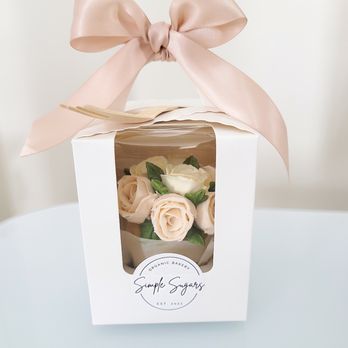 Simple Sugars - a white box with pink roses in it - Desserts Near Me