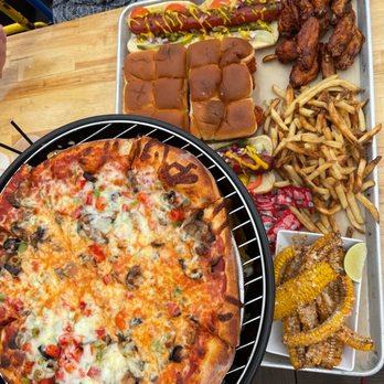 Utopian Tailgate - Beef Sliders, Spicy Crispy Chicken Sliders, Standard hot dog (Chicago-Style), Wings, "Out & In" Animal Fries, Elote Ribs, Garden Pizza - Lounges Near Me - Chicago, Illinois Utopian Tailgate - Beef Sliders, Spicy Crispy Chicken Sliders, Standard hot dog (Chicago-Style), Wings, "Out & In" Animal Fries, Elote Ribs, Garden Pizza - Lounges Near Me - Chicago, Illinois