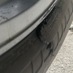 Tim's Roadside Service - Badly damaged tire- he looked to see if he could fix it but there's no fixing this...