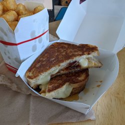 Roxy's Gourmet Grilled Cheese - Bacon hot honey grilled cheese and truffle tots.