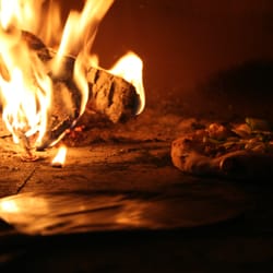 Switchback Pizza Company At Easton - Pizza cooking in our mobile wood oven.