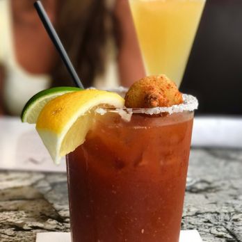Nick's Laguna Beach - NICK's ORIGINAL BLOODY MARY, it's their House Recipe, Salted Rim & topped with a Fried Blue Cheese Stuffed Olive! - American Near Me - Laguna Beach, California Nick's Laguna Beach - NICK's ORIGINAL BLOODY MARY, it's their House Recipe, Salted Rim & topped with a Fried Blue Cheese Stuffed Olive! - American Near Me - Laguna Beach, California