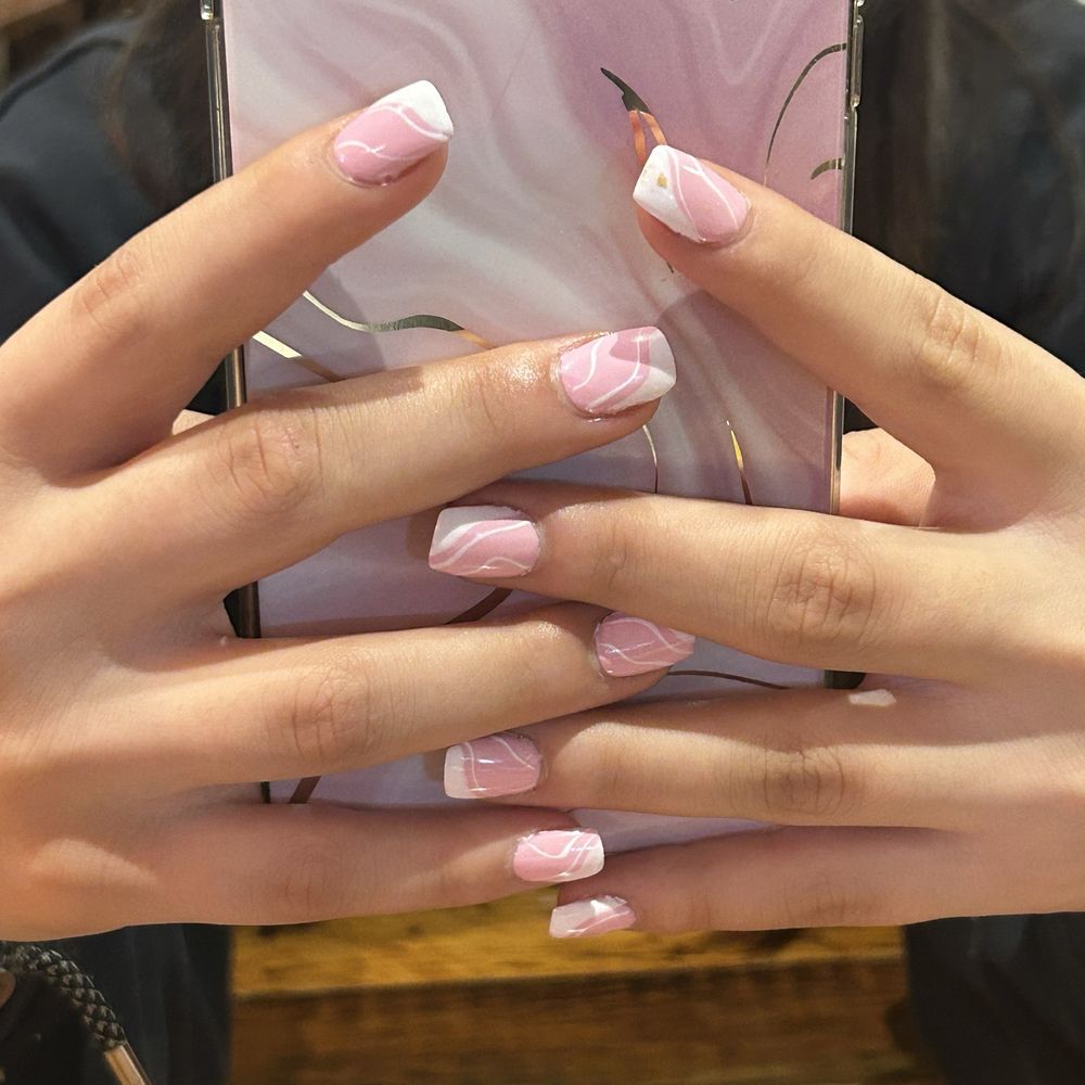 Pink acrylic nails with white designs Pink acrylic nails with white designs