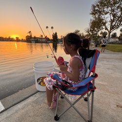Fishing at sunset. Teaching them young .