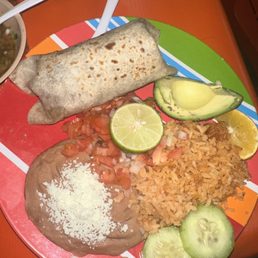 Chicken burrito with a side of rice and beans Chicken burrito with a side of rice and beans