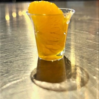 Ole Smoky Distillery "The Barn" - Mandarin orange flavored. Loved its taste & the colors & light in this picture - Distilleries Near Me - Pigeon Forge, Tennessee Ole Smoky Distillery "The Barn" - Mandarin orange flavored. Loved its taste & the colors & light in this picture - Distilleries Near Me - Pigeon Forge, Tennessee