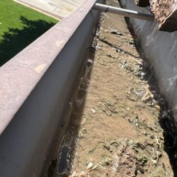 Arizona gutters don't fill with leaves. We get something a lot heavier.