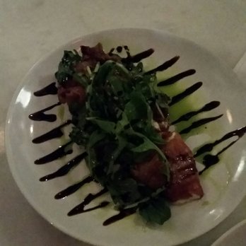 Antonio's Bacaro - Prosciutto wrapped mozzarella with a balsamic reduction drizzle. SO GOOD! - Italian Near Me - Hyde Park, Massachusetts Antonio's Bacaro - Prosciutto wrapped mozzarella with a balsamic reduction drizzle. SO GOOD! - Italian Near Me - Hyde Park, Massachusetts