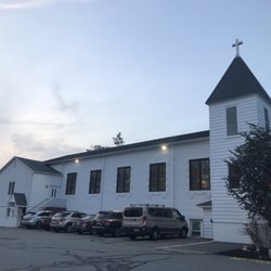 Saint Joseph Roman Catholic Church - There is an entrance here for the basement hall (by parked car) and a side entrance (see stairs) to the front of the church
