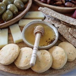 The Rind & Truckle - Evelyn's crackers, cheese, provisions cheddar thyme shortbread, smoked honey and garlic stuffed olives.