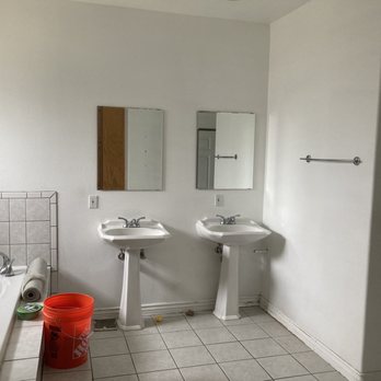 Inspired Remodels - Before picture of master bathroom from toilet area looking at double vanity - General Contractors Near Me - Lake Forest, California