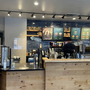 Starbucks - a coffee shop counter with a menu on the wall - Coffee & Tea Near Me - Cherry Hill, New Jersey Starbucks - a coffee shop counter with a menu on the wall - Coffee & Tea Near Me - Cherry Hill, New Jersey