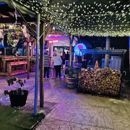 Outdoor area at night The outdoor patio lit up at night with great vibes and a cozy atmosphere.