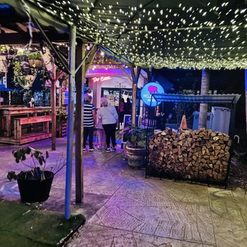 Tap Beer - Outdoor area at night The outdoor patio lit up at night with great vibes and a cozy atmosphere. - Beer, Wine & Spirits Near Me - North Miami Beach, Florida Tap Beer - Outdoor area at night The outdoor patio lit up at night with great vibes and a cozy atmosphere. - Beer, Wine & Spirits Near Me - North Miami Beach, Florida