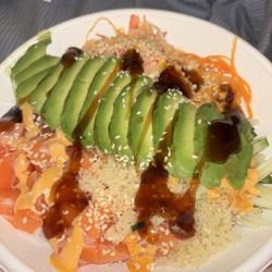 Manna Asian Cuisine - Build own bowl. Salmon, avocado, white rice, carrots, cucumber, seaweed salad, spicy mayo and I added teriyaki on top.