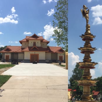 Sri Guruvayurappan Temple - The main temple and the multi tiered brass lamp with a figure if Garuda on top - Hindu Temples Near Me - Houston, Texas Sri Guruvayurappan Temple - The main temple and the multi tiered brass lamp with a figure if Garuda on top - Hindu Temples Near Me - Houston, Texas