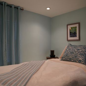 Samantha James Salon - Massage room with thoughtful addition of a little waterfall element and comfortable massage bed. - Hair Salons Near Me - Potomac, Maryland Samantha James Salon - Massage room with thoughtful addition of a little waterfall element and comfortable massage bed. - Hair Salons Near Me - Potomac, Maryland