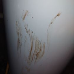 Hood Heating Air Plumbing and Electric - This is the crap they wiped all over my basement. This hot water heater was brand new and perfectly white.