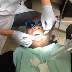 Marina Park Dental - In the seat as Dr. Cho works her magic on inserting a crown. Shades blocked out florescent light. Was watching a Netflix show at the time.