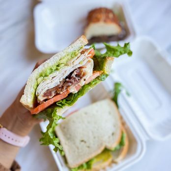 The Willows Market - a person holding a sandwich - Grocery Near Me - Menlo Park, California