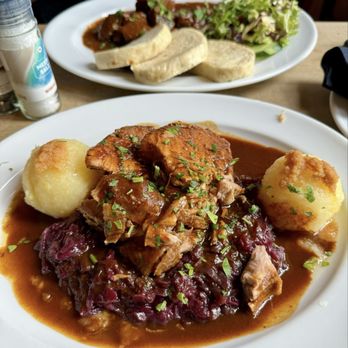 Luisenbräu - Pork on red cabbage with potato dumplings - German Near Me - Berlin, BE