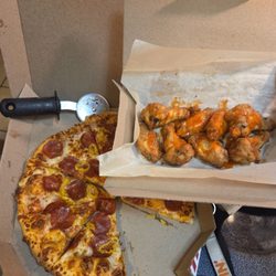 Domino's Pizza - Cold wings and pizza after ordering online and getting there and waiting another 15 minutes.