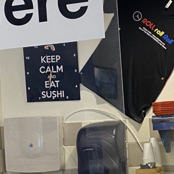 ROLL roll Roll - The kitchen's strainer in hand-washing sink with company t-shirt. - Sushi Bars Near Me - Los Angeles, California ROLL roll Roll - The kitchen's strainer in hand-washing sink with company t-shirt. - Sushi Bars Near Me - Los Angeles, California