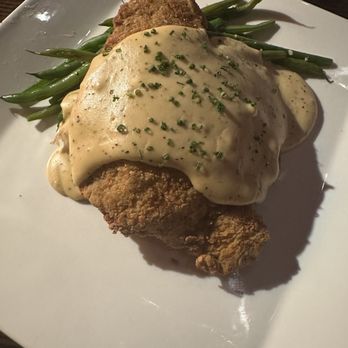 Gimme Gimme - a plate of chicken with gravy and green beans - Bars Near Me - San Antonio, Texas