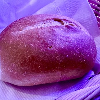 La Granja De Oro - a loaf of bread in a basket - Peruvian Near Me - Falls Church, Virginia