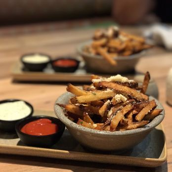 Moku Kitchen - garlic parmesan truffle fries.  you probably had it before somewhere else.  this isn't any different - Cocktail Bars Near Me - Honolulu, Hawaii