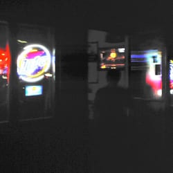 Side Tracked - Crappy superdark picture of my friend entering the bar.