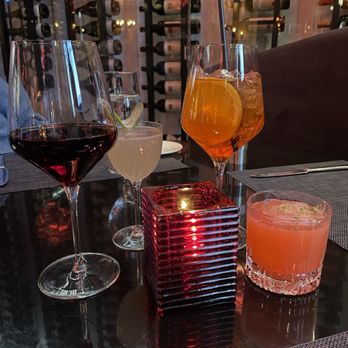 PepeNero Ristorantino Mediterraneo - Aperol spritz, Northwood, strawberry drink (cannot recall name the name)and vino set the tone for a memorable meal with friends. - Italian Near Me - Traverse City, Michigan