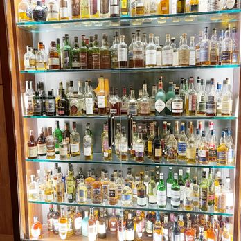 The Scotch Library - a collection of liquor bottles - Cocktail Bars Near Me - Scottsdale, Arizona