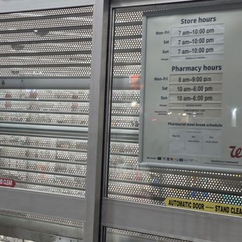 Walgreens - Entrance to the store and sign of hours. - Drugstores Near Me - Covina, California Walgreens - Entrance to the store and sign of hours. - Drugstores Near Me - Covina, California