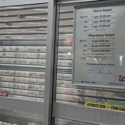 Entrance to the store and sign of hours.