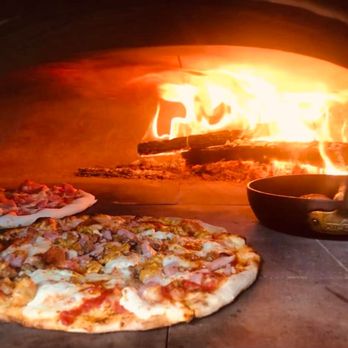 Gabino’s Wood Fired Pizza - two pizzas in front of an oven - Food Trucks Near Me - Conroe, Texas Gabino’s Wood Fired Pizza - two pizzas in front of an oven - Food Trucks Near Me - Conroe, Texas