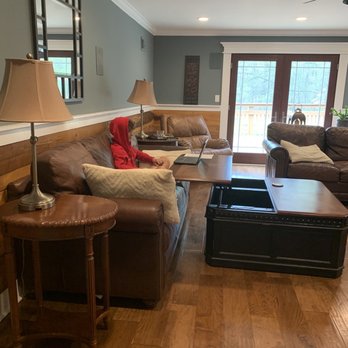 Peacock Home Services - a living room with brown leather furniture - Handyman Near Me - Pittsboro, North Carolina Peacock Home Services - a living room with brown leather furniture - Handyman Near Me - Pittsboro, North Carolina