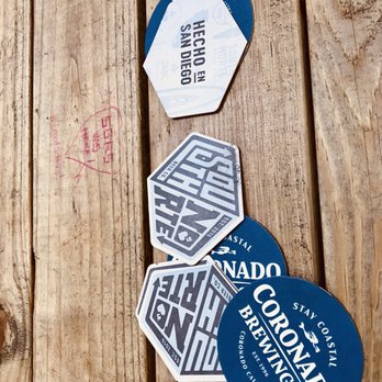 Coronado Brewing - Beer coasters on an indoor picnic table. - Brewpubs Near Me - San Diego, California Coronado Brewing - Beer coasters on an indoor picnic table. - Brewpubs Near Me - San Diego, California